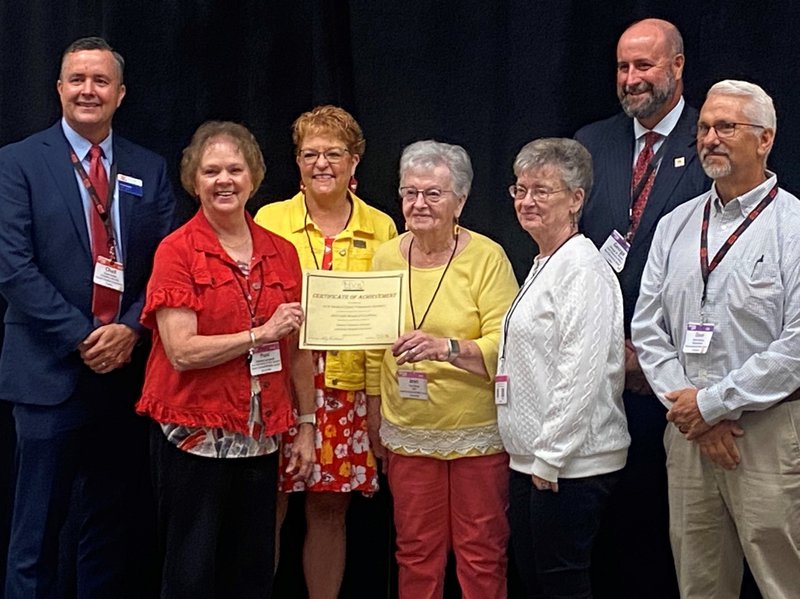 Jean Buoy, HVK Dist. 3 Coordinator, presents Gold Award to NCKMC Volunteers . From left – Chad Austin, KHA President, Pam Campbell, Shirley Van Loenen, Jean Buoy, Rita Goodwin, George Stover KHA Board Chair, David Garnas, NCKMC Administrator.
